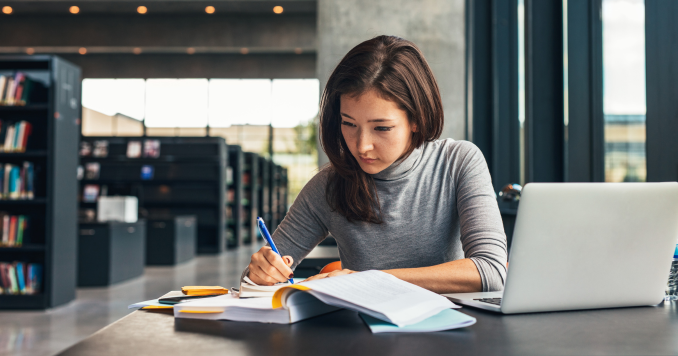 Woman studying in a library